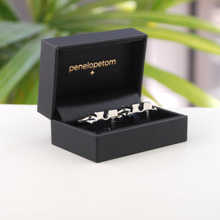 Personalised 'Missing Piece' Jigsaw Cufflinks shown in black penelopetom cufflinks box