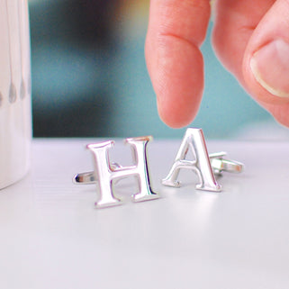Personalised alphabet cufflinks in "H" and "A" shown in close up shot