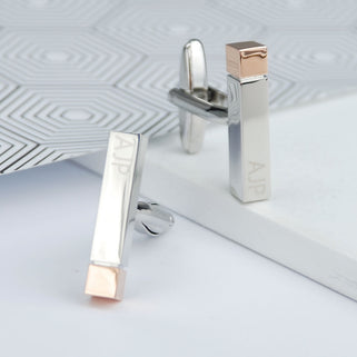 Silver initial bar cufflinks with rose gold tips and personalised initials "AJP" engraved at each end.