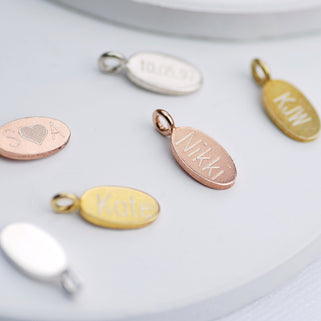 Oval disc charms in silver, gold and rose gold with personalised engraved name or message