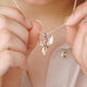 Personalised Phoenix Strength Positivity Pendant shown close up on model