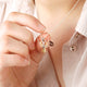 Personalised Phoenix Strength Positivity Pendant shown close up on model