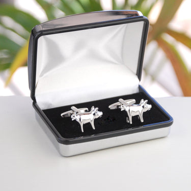 Silver pig cufflinks shown in silver chrome rectangle cufflinks box