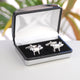 Silver pig cufflinks shown in silver chrome rectangle cufflinks box