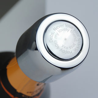 Prosecco stopper with personalised spiral message shown in close up with model