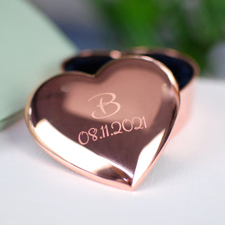 personalised rose gold plated heart trinket box with "B" in the centre and "08.11.2021" engraved underneath, shown in close up shot.