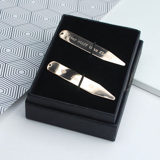 Rose gold collar stiffeners with "heart Simon heart" engraved on one and "Better stiff than floppy" engraved on the other, shown in close up shot in Penelopetom Packaging