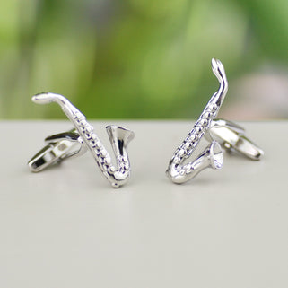 silver saxophone cufflinks shown in close up shot