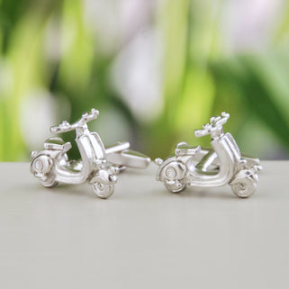 Silver scooter cufflinks shown in close up shot