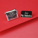 Love letter secret message pin with a double heart icon engraved on the front of the envelope and 