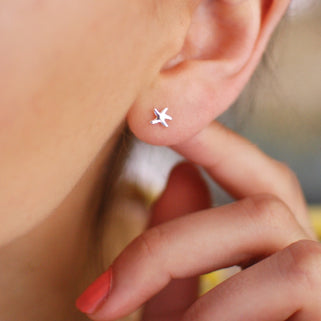 Silver Mini Starfish Studs shown in close up shot on model