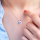 Birthstone and initial disc necklaces, various examples shown in close up shot.