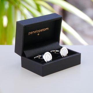 Silver porthole cufflinks shown in black Penelopetom cufflinks box