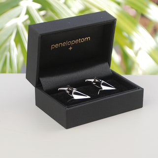 silver paper plane cufflinks shown in black Penelopetom cufflinks box