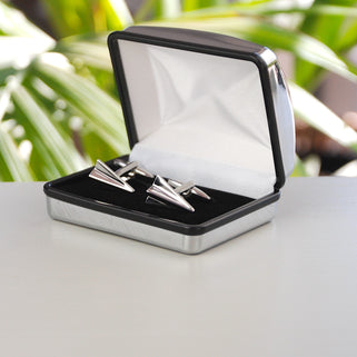 Silver paper plane cufflinks shown in silver chrome rectangle cufflinks box