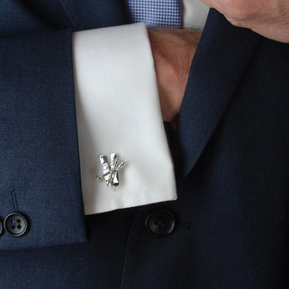 silver ski cufflinks shown in models shirt sleeve
