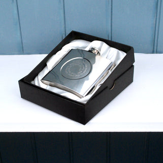 Silver hip flask with engraved spiral message on the front shown in black  gift box. 
