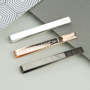Tie slides shown in 3 polished metal colours with personalised messages on the front and back.