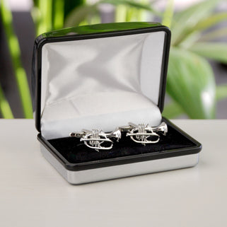 Silver trumpet cufflinks shown in silver chrome rectangle cufflinks box