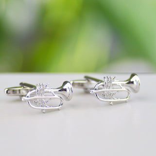 Silver trumpet cufflinks shown in close up shot