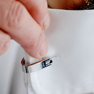 Contemporary Wrap Cufflinks with personalised "PSR" engraved shown on close up on model