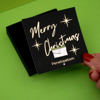 Christmas Card Message Pin with snowflake engraved on the front shown on Merry Christmas Penelopetom Card