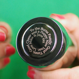 Prosecco stopper with personalised spiral message shown in close up with model