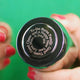 Prosecco stopper with personalised spiral message shown in close up with model